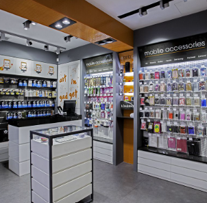 Accessories wall with phone covers cases and earbuds at Novelty Telecom